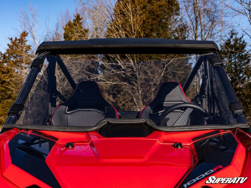 SuperATV scratch resistant full windshield on a red Honda Talon 1000, straight front view of the clear panel