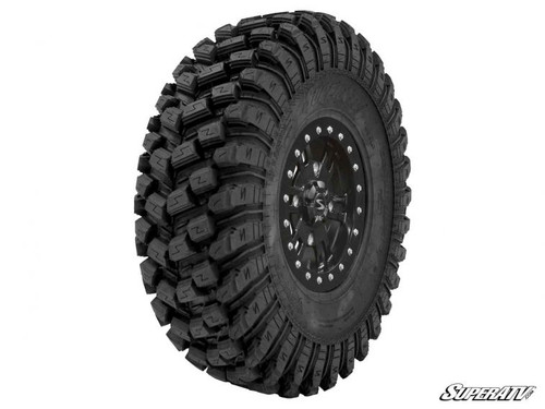 SuperATV XT Warrior 28x10x14 tire on a black wheel, side view showing the tight all-terrain tread block pattern