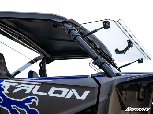 SuperATV scratch-resistant flip windshield tilted open on a blue Honda Talon 1000, close side view of the hinge