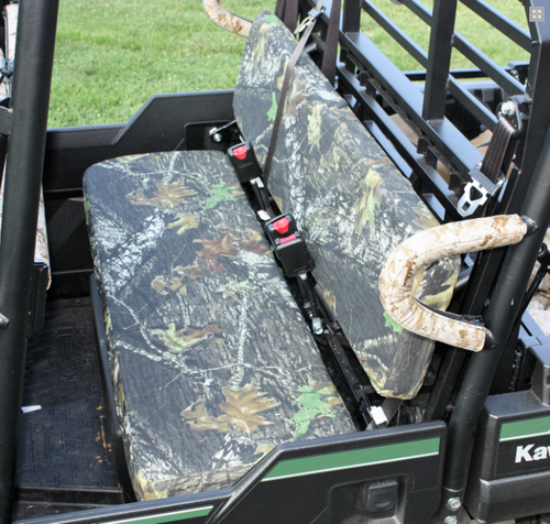 Close-up of a Greene Mountain leaf camo seat cover on the rear bench of a Kawasaki Mule Pro FXT with camo grab handle