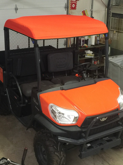 Greene Mountain orange soft top on a Kubota RTV X900, front view with the black bench behind the cab