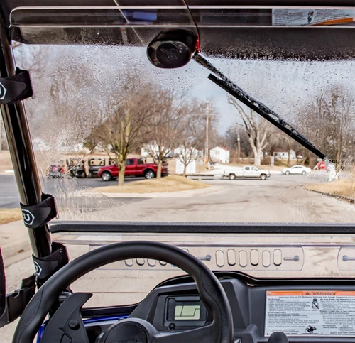 View from the driver seat through the Moto Alliance Evolution windshield showing the wiper arm and blade