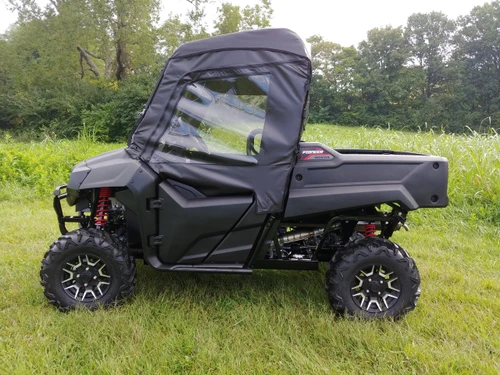 3 Star soft doors kit in black on a gray Honda Pioneer 700-2 with soft top, side profile in a field