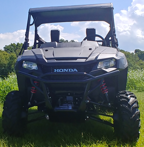 Front view of a green Honda Pioneer 700-2 with the 3 Star soft top over the cab and headrests visible