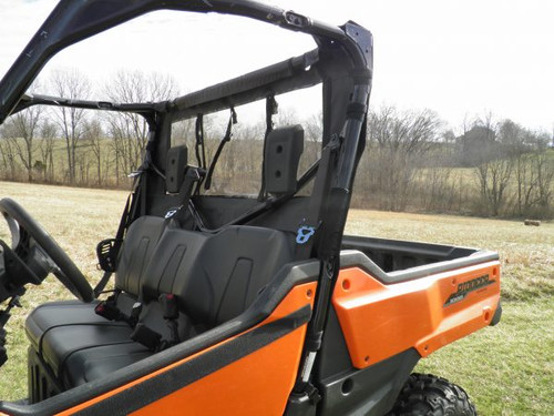 Passenger side view of the 3 Star soft back panel behind the seats of an orange Honda Pioneer 1000, window rolled up