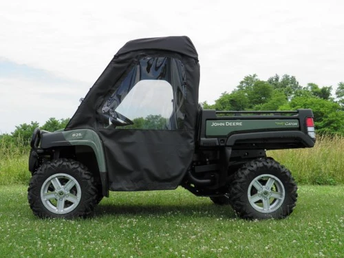 Driver side profile of the John Deere Gator XUV with the 3 Star cab enclosure showing the full door window