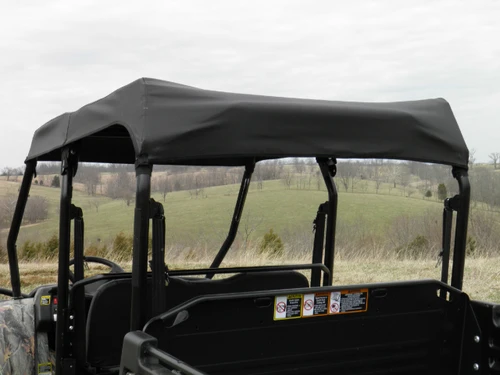 3 Star black soft top over the four-seat cab of a camo John Deere Gator XUV-4, rear view from the cargo bed