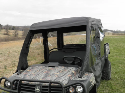 3 Star full cab enclosure on a camo John Deere Gator XUV-4 with hard windshield, front three-quarter view in a field