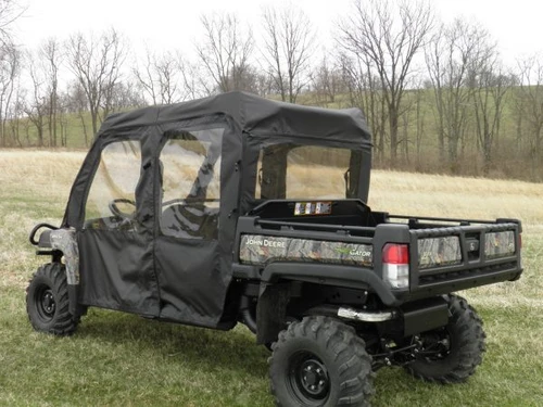 Rear three-quarter view of the 3 Star full cab enclosure with rear window and four doors on a camo John Deere Gator XUV-4