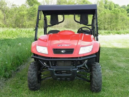 3 Star black soft top installed on the roll cage of a red Kymco 500, straight front view on grass