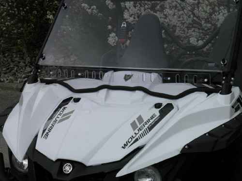 3 Star one-piece windshield on a white Yamaha Wolverine, angled close-up showing the vent slots and edge seal