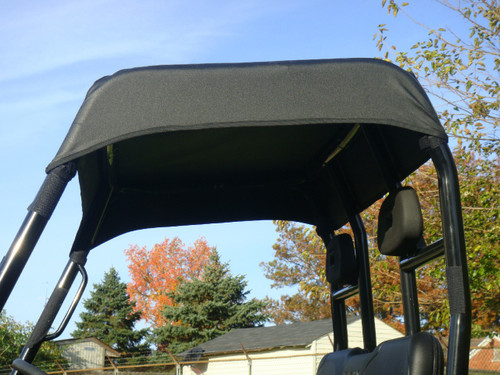3 Star black soft top installed over the roll cage of a Polaris Ranger, close underside view against blue sky
