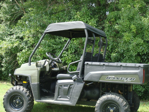 3 Star black soft top on a green Polaris Ranger, side view beside trees