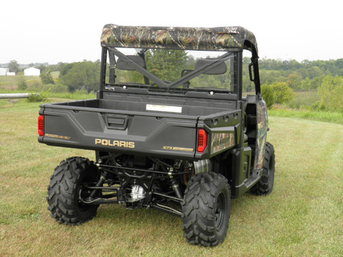 Rear three-quarter view of the camo Polaris Ranger XP900 with the 3 Star camo soft top and cargo bed