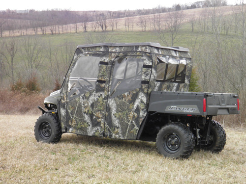 3 Star camo soft doors and rear window on a Polaris Ranger Crew, rear 3/4 view in a field