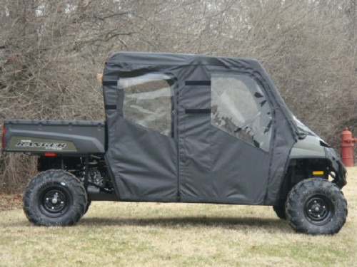3 Star full cab enclosure on a Polaris Ranger 570-6/800 Crew, side view of black soft doors with windows in a field