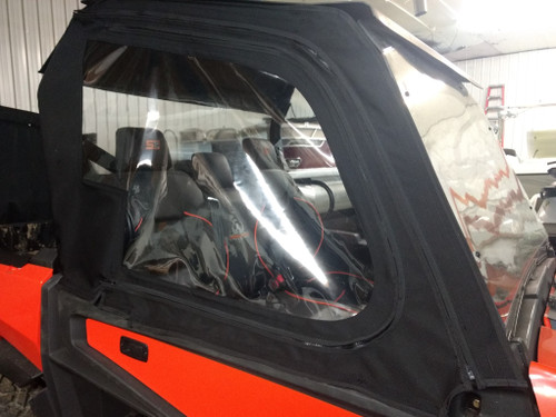 Close-up of the Side X Side upper door clear window above the orange hard lower door of the Intimidator GC1K