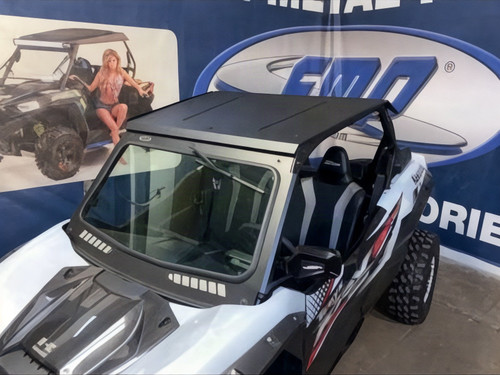 Extreme Metal Products black aluminum roof on a white Kawasaki Teryx KRX 1000 with windshield, front three-quarter view