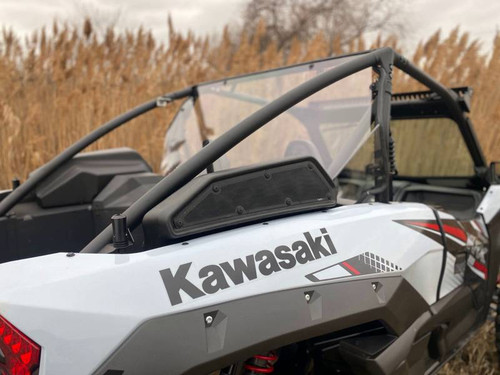 Extreme Metal Products clear cab back installed behind the seats of a white Kawasaki Teryx KRX 1000, rear side view