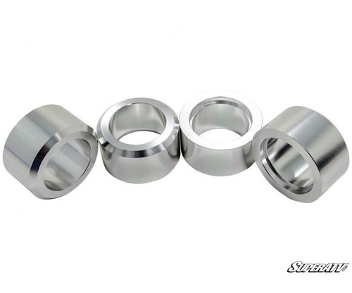 Four machined aluminum shock spacers from the SuperATV Can-Am Maverick Trail 3-inch lift kit on white
