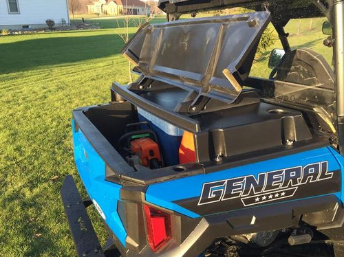 Extreme Metal Products bed cover propped open on a blue Polaris General XP 1000 showing gear stored in the bed