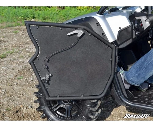 SuperATV aluminum door open on a silver Yamaha Viking, black panel with tubular frame and latch