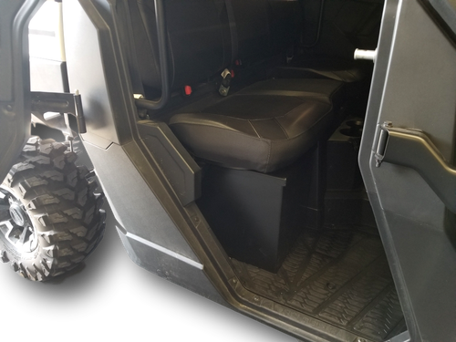 Hi-Standard under seat storage security box installed below the seat of a Polaris Ranger, viewed through the open door