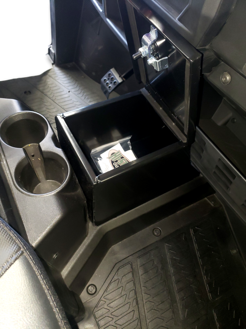Hi-Standard center console security box installed in a new style Polaris Ranger with the lid open showing the interior