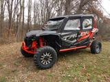 Small front three-quarter view of a Honda Talon 4 with the Side X Side upper doors kit installed