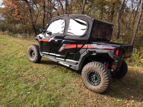 Rear three-quarter view of the Polaris General 4 with the Side X Side upper doors and rear window, in the woods