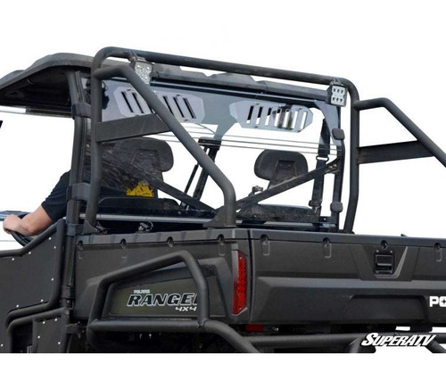 SuperATV vented full rear windshield installed behind the seats of a black Polaris Ranger 800, rear three-quarter view