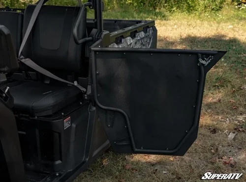 SuperATV aluminum door swung open on the CF Moto UForce 1000 showing the seat, seat belt and door hinge side