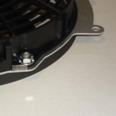 Close-up of the mounting tab and bolt on the Universal Parts Kawasaki Teryx 750 fan shroud