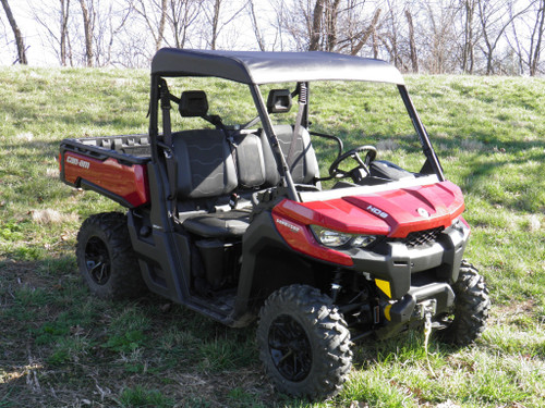 3 Star soft top installed on a red Can-Am Defender, front three-quarter view in a grassy field