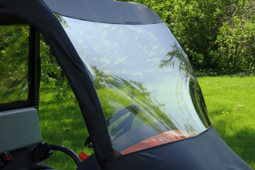 Close-up of the 3 Star clear vinyl windshield and black soft top edge on a Kubota RTV 400/500, inside view