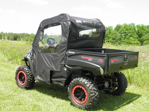 3 Star full cab enclosure soft doors and top on a black side-by-side with red bead wheels, rear three-quarter view
