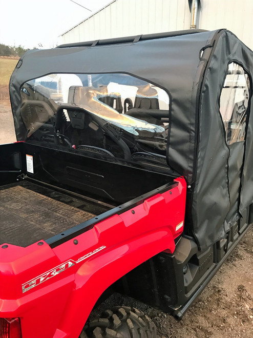 Greene Mountain rear window on a red Yamaha Viking VI, rear three-quarter view beside the cargo bed