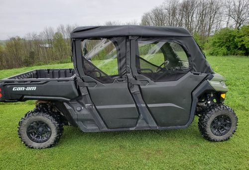 3 Star soft half doors and rear window combo on a green Can-Am Defender Max, side view in a grassy field
