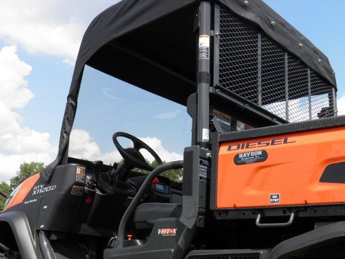 Close-up of the 3 Star soft top frame and vinyl windshield on the orange Kubota RTV cab