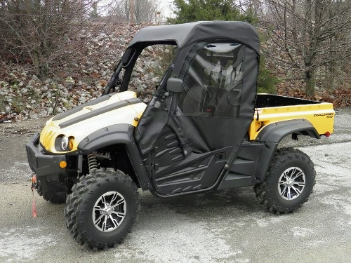 3 Star full cab enclosure with half doors and top installed on a yellow Cub Cadet Challenger, front three-quarter view
