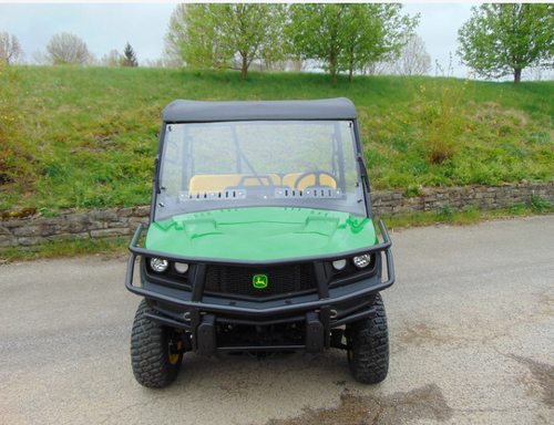 Straight-on front view of the John Deere Gator with the 3 Star soft top over the cab and windshield