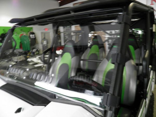 Front view of the 3 Star scratch-resistant windshield on a white Kawasaki Teryx 750 inside a shop