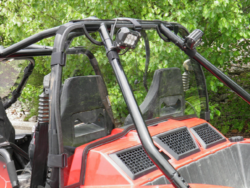 3 Star Lexan back panel behind the seats of a red Arctic Cat Wildcat, clear panel between the cage tubes, rear angle