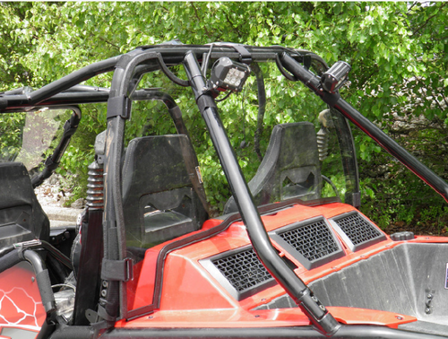 3 Star Lexan back panel installed behind the rear seats of a red Arctic Cat Wildcat 4, angled view
