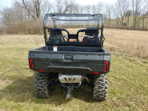 Straight rear view of the CF Moto UForce showing the 3 Star clear back panel above the cargo bed