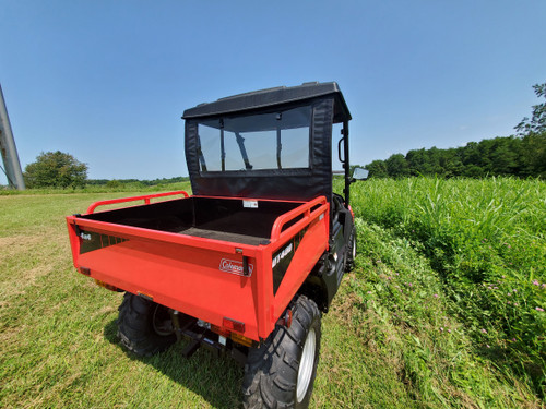 3 Star soft back panel with clear window on a red Coleman UT400 with soft top, rear three-quarter view in a field