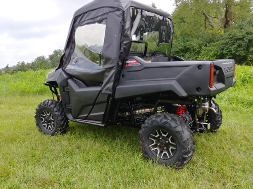 3 Star full cab enclosure with vinyl windshield on a grey Honda Pioneer 700, rear three-quarter view with doors zipped