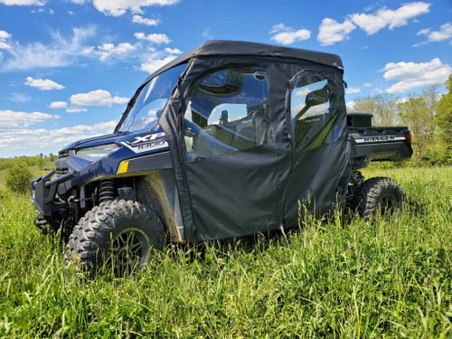 3 Star full cab enclosure on a blue Polaris Ranger Crew 1000, black cab with clear windows, front 3/4 view in grass