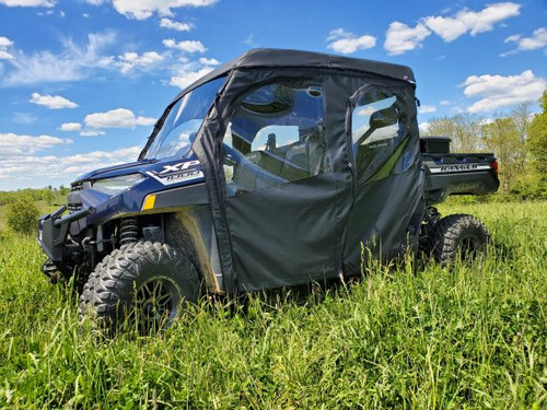 3 Star soft doors on a blue Polaris Ranger 1000 Crew, driver side front angle in tall grass