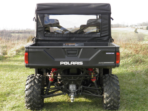 3 Star black soft back panel with clear window on a Polaris Ranger Crew, straight rear view on grass